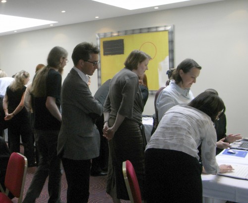 Participants watching and using the throttled laptops